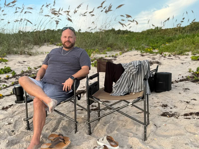 Jacob relaxing in a chair on the beach