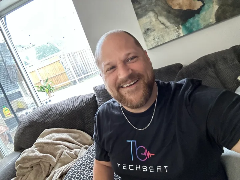 Jacob on the couch in a TechBeat shirt